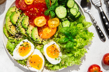 Healthy Salad Bowl with Avocado, Eggs, Tomatoes and Cucumbers, 