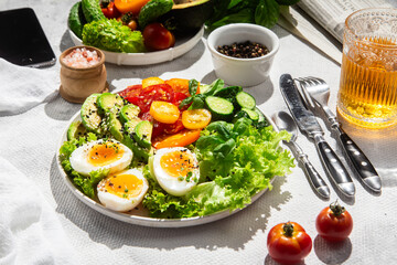 Healthy Salad Bowl with Avocado, Eggs, Tomatoes and Cucumbers, 