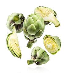 Fresh raw Artichoke falling in the air isolated on white background. High resolution image