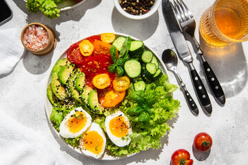 Healthy Salad Bowl with Avocado, Eggs, Tomatoes and Cucumbers, 