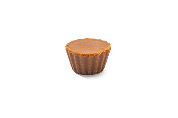 Single Fudge Cup White Background. A single fudge cup with a smooth surface and fluted rim is...