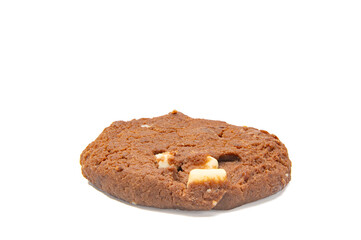 Flat Chocolate Cookie White Background. A flat, round chocolate cookie with white and dark chocolate pieces lies on a white background. The cookie appears soft and homemade.