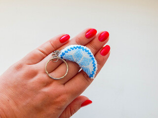 Women's palm with beading keychain on white background