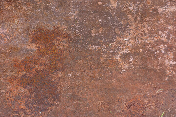 Detailed close up of a heavily rusted metal surface showing signs of wear and tear.