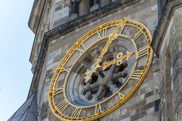 Side perspective of the same historic clock, emphasizing depth and structure. Golden details...