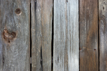 Weathered wooden planks with visible grain and texture details, perfect for backgrounds.