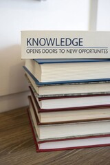Stacked Books with Inspirational Quote on Knowledge and Opportunities