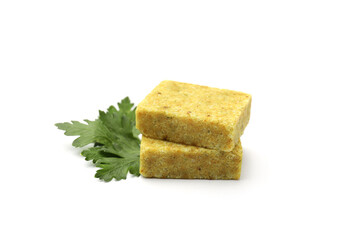 Aromatic bouillon cubes and parsley isolated on white