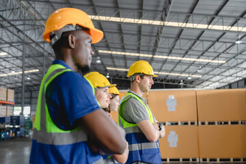 Confident multicultural warehouse team standing in line with arms crossed, representing teamwork, professionalism, and readiness in automotive logistics environment, Professional factory leadership