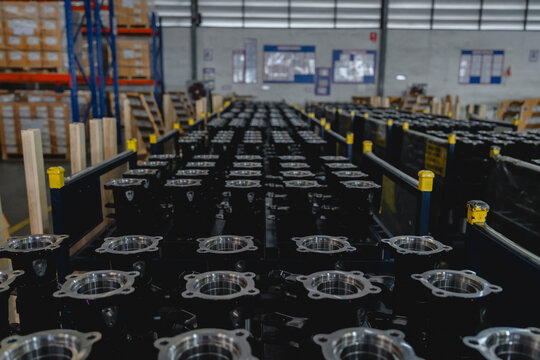 Rows of automotive parts organized in warehouse, showing mass production and inventory management in transport industry. Transport supply chain efficiency concept