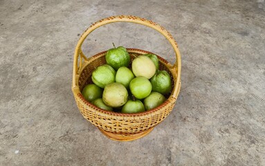 Red-fleshed guava in a woven basket