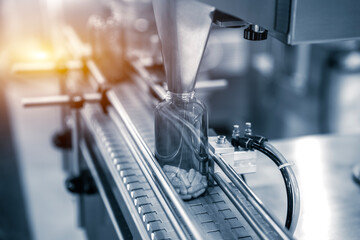 Tablet, Capsule counting machine conveyor in production line of pharmaceutical industry.