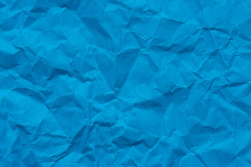 Blue macro crumpled paper backdrop,Crumpled blue paper texture as a background.