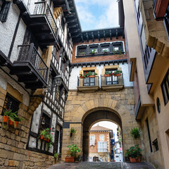 Stone arch that gives access to the Plaza de Guipuzcoa in the beautiful Basque town of Hondarribia,...