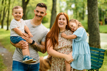 Beautiful happy family enjoying in the park