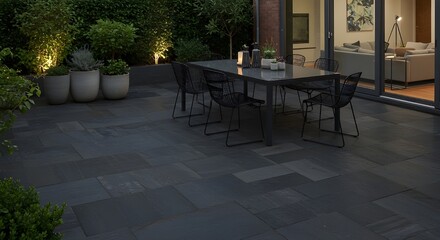 Fototapeta premium Modern Patio with Deep Charcoal Pavers and Sleek Black Wire Chairs – Contemporary Outdoor Space for Relaxation, Entertaining, and Sophisticated Urban Living Environments