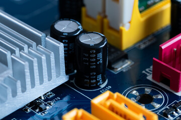Capacitors or condensers on motherboard close up, electronic components