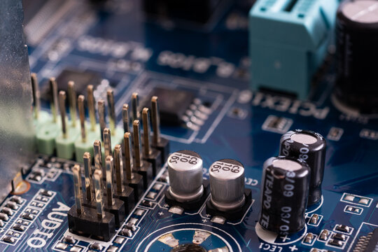 Capacitors on motherboard close up, electronic components