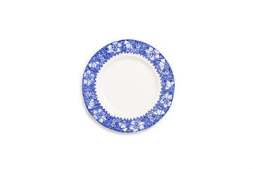 A blue and white england style ceramic round plate on a white background in a top view