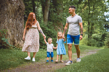 Fototapeta premium Beautiful happy family enjoying in the park