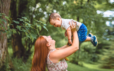 Mother having great time with his son on forest