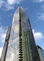 tall skyscraper residential and commercial buildings in long island city queens new york (new modern construction sky reflection clounds) minimal detail close up