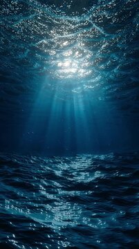 Deep underwater ocean abyss with ethereal blue sunlight rays