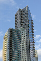 tall skyscraper residential and commercial buildings in long island city queens new york (new modern construction sky reflection clounds) minimal detail close up