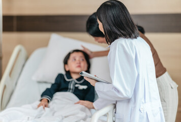 Caring Asian Female Doctor with Child Patient and Mother