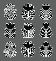Black floral motifs with leaves and berries vector