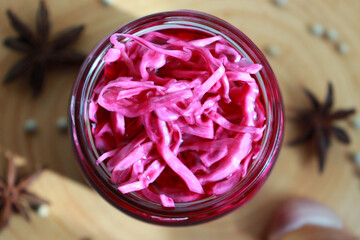 Homemade pickled purple cabbage in glass bottles. Probiotics food.
