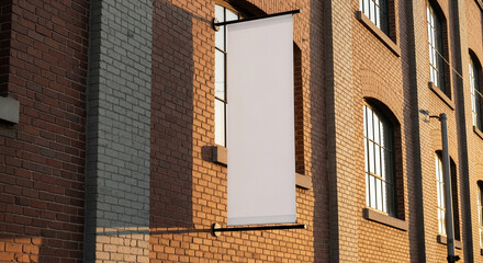 Naklejka premium Blank Vertical Banner Mockup on Old Brick Building Facade