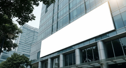 Blank White Billboard on Modern Glass Office Building Facade