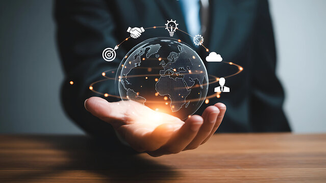 Businessman holding a digital globe with business icons for global connection and innovation. - Powered by Adobe