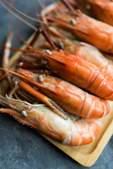 King prawns is steamed served on wood tray, a common eating with diping a seafood sace