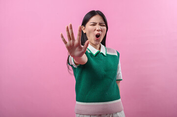 Asian woman showing a strong 