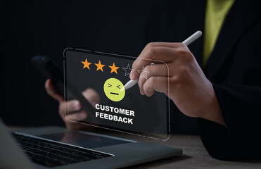 An office worker gives a three-star rating with an unsatisfied emoji on a digital interface, representing customer feedback, dissatisfaction, service quality review, and user opinion on performance.