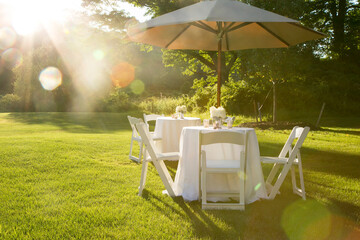 Kent, Connecticut, USA. Outdoor dining on a country lawn in summer. 