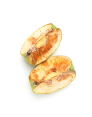 Pieces of spoiled apple isolated on white, top view