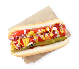 Tasty hot dog with pickles, onion, ketchup and mustard isolated on white, top view