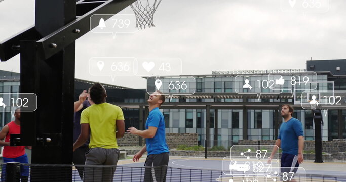 Group of five men playing basketball in community court, with hoop net and social media overlays