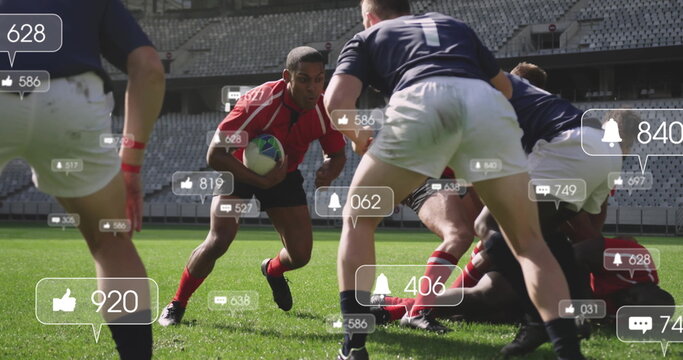 Charging red jersey player gripping rugby ball on grass field, with floating social media icons