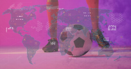 Positioning legs in red socks and black cleats in studio, with soccer ball, digital map overlay