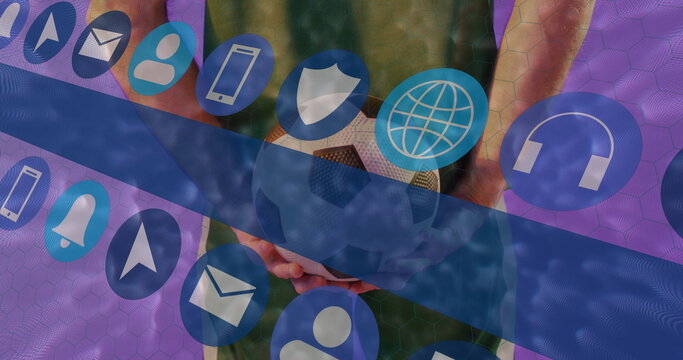 Male athlete in green jersey holding soccer ball behind back in hex grid, with tech icons - Powered by Adobe