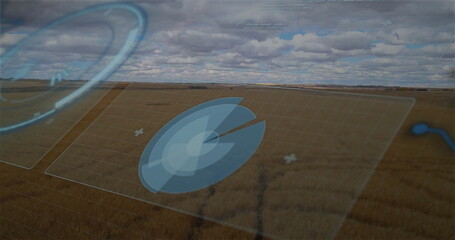 Displaying translucent circular radar panel over rural farmland, with grid panels and overlay icons