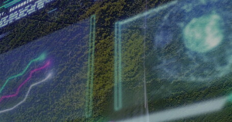 Showing digital overlay floating above forest canopy with panels, charts, HUD and alphanumeric text