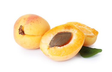 Fresh ripe apricots with green leaf isolated on white