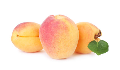 Fresh ripe apricots with green leaf isolated on white