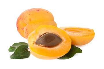 Fresh ripe apricots and green leaves isolated on white