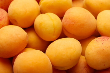 Fresh ripe sweet apricots as background, above view